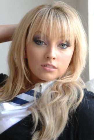 47913247_007_6349 Adorable babe in black socks Elle Parker taking off her school uniform