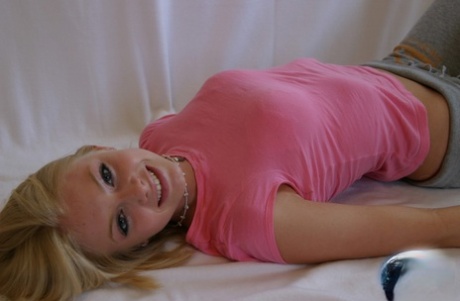 69618044_007_aa6d Cute teen girl Skye Model hangs out in a pink shirt and her yoga pants