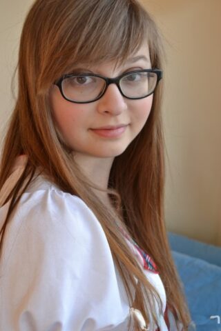 Adorable schoolgirl in glasses Lilah Demaray fingers & toys her chubby pussy