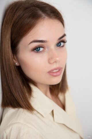 64274463_007_3165 Glamorous teen Keira Blue strips her sexy coat off and spreads her cute beaver